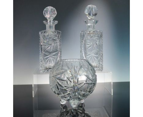 This dazzling 3-piece crystal set from American Cut Crystal Corp features two square decanters and a rounded footed bowl, all