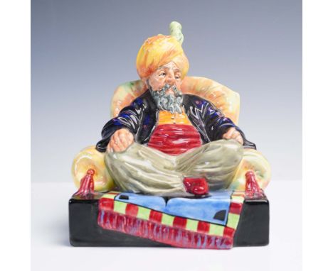 This vivid Royal Doulton figurine, Abdullah HN2104, captures the commanding presence of a seated elder in a richly colored tu