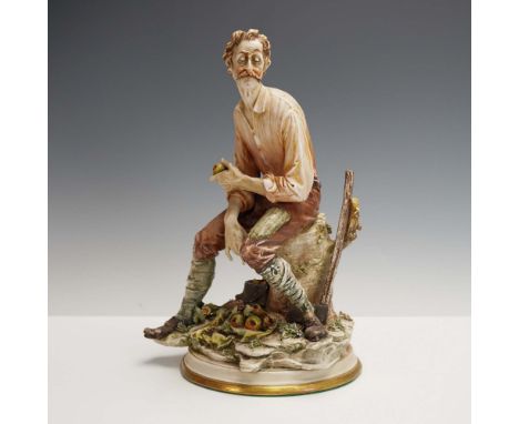 Crafted in Italy by celebrated porcelain artist Antonio Borsato, this expressive figurine captures a rugged, contemplative mo