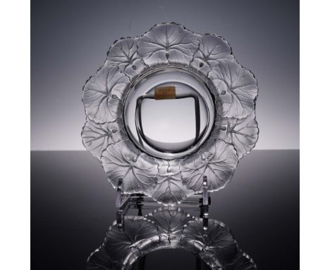 The Honfleur ashtray by Lalique is adorned with a delicate ring of ginkgo-style leaves in frosted crystal, surrounding a smoo