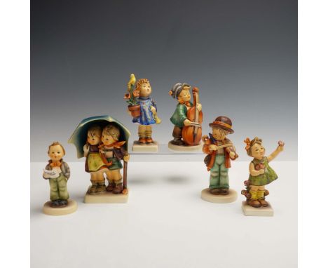 This delightful 6pc collection of Hummel Goebel porcelain figurines features a charming ensemble of children captured in expr