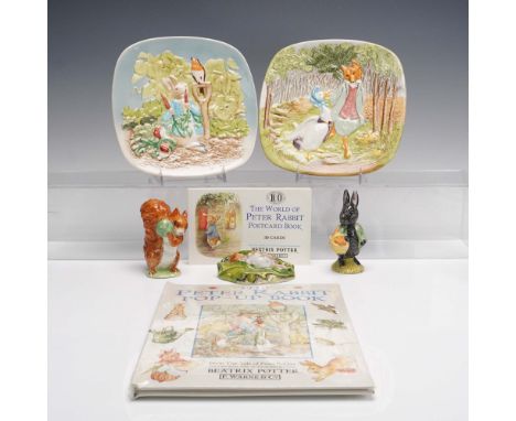 Grouping of seven collectible items featuring Beatrix Potter characters. Includes "The World of Peter Rabbit Postcard Book", 