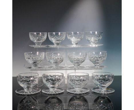 Crafted by Ireland's celebrated Waterford Crystal, this 12-piece set of footed dessert dishes showcases the enduring elegance