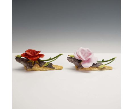 This vibrant pair of Boehm porcelain roses features a soft pink bloom (model 200-55-P) and a rich dusty red bloom (model 200-
