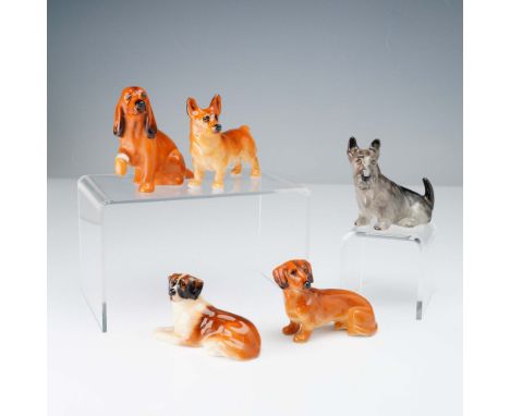 A delightful group of five Royal Doulton bone china dog figurines from the popular Dogs series, each finely hand-painted with