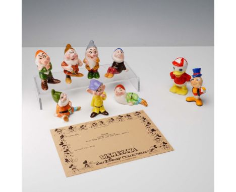 Charming 9-piece collection of hand-painted miniature ceramic Disney figurines, prominently featuring the full cast of the Se