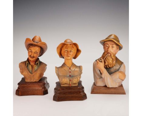 A set of three expressive carved bust figurines including two limited edition Anri pieces designed by Edward Rohn and a third