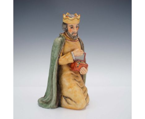 Crafted by Goebel of West Germany, this hand-painted porcelain figurine features a kneeling king in regal attire, crowned and