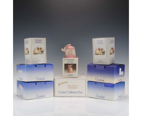 Set of 8 Goebel M.I. Hummel bell ornaments, including two "Flying High" figurines. Each porcelain or bisque piece features cl