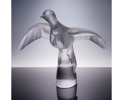 Impressive frosted sculptural figure of a dove in flight; engraved design on widespread wings. Raised on a pedestal base. Lal