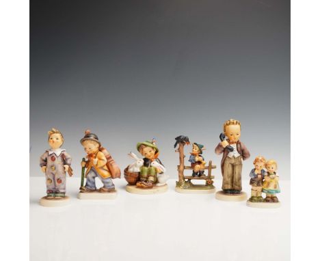 Charming assortment of six Goebel Hummel porcelain figurines, each featuring detailed hand-painted scenes of children in vari