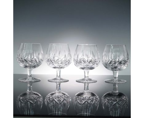 Made by the distinguished Irish crystal house Waterford, this set of four tall brandy glasses features the Platinum Lismore p