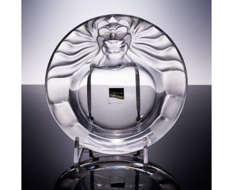 This piece showcases the exceptional artistry of Lalique, featuring a lion's head in high relief. The lion's mane is intricat