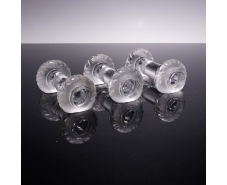 This set of three crystal utensil rests by Lalique features a frosted leaf motif encircling each rounded end, contrasting ele