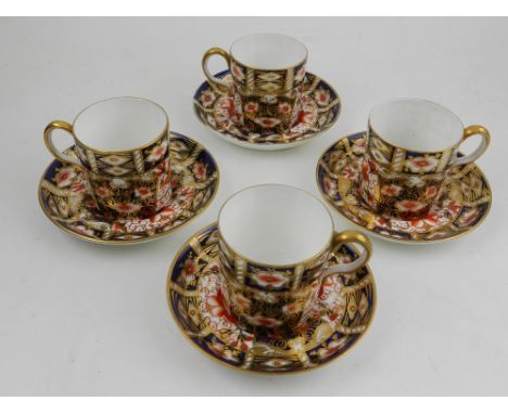 A set of four Royal Crown Devon coffee cups and saucers. 