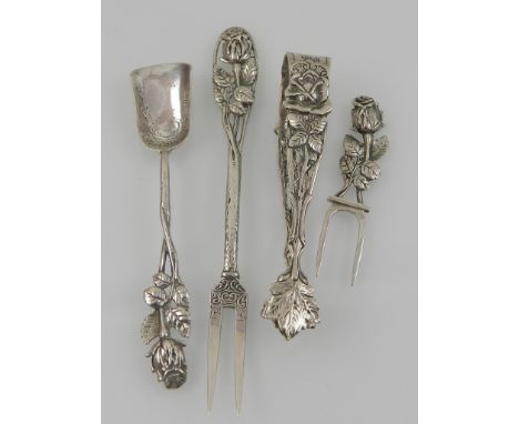 Four items of silver, to include a pair of silver sugar-nips, rose embossed, together with a silver sugar shovel, a pickle fo