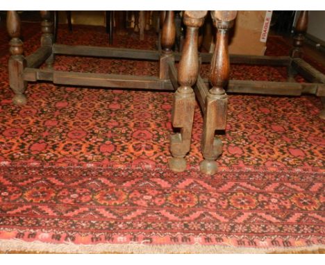 An Afghan Bashiri carpet, decorated with stylised flowers to centre, multi-bordered and fringed. L.300cm W.260cm