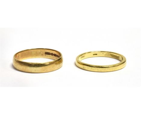TWO BAND RINGS  a marked 375 band ring, size R, weight 2.7grams, a yellow metal band ring, indistinct markings, testing indic