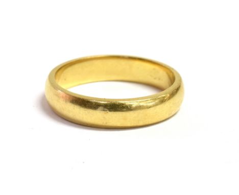 AN 18CT GOLD BAND RING  the ring hallmarked for Birmingham 1979, ring size K, weight 3.8grams