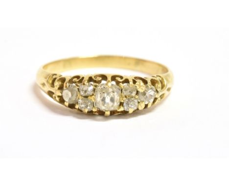 AN OLD CUT DIAMOND, SEVEN STONE BOAT RING the diamonds of various sizes with the central diamond measuring 0.4cm in diameter,