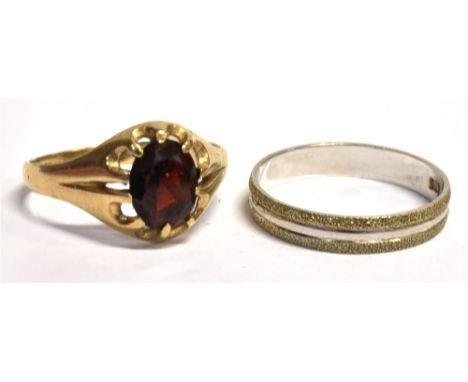 TWO DRESS RINGS  a 9ct gold, garnet solitaire ring, faded hallmark to the shank, ring size T, weight 2.3grams, a stamped 375 