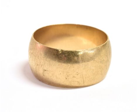 A 9CT GOLD WIDE BAND RING THE RING  with faded hallmark, measuring 1.1cm wide, size S approx., weight 8grams