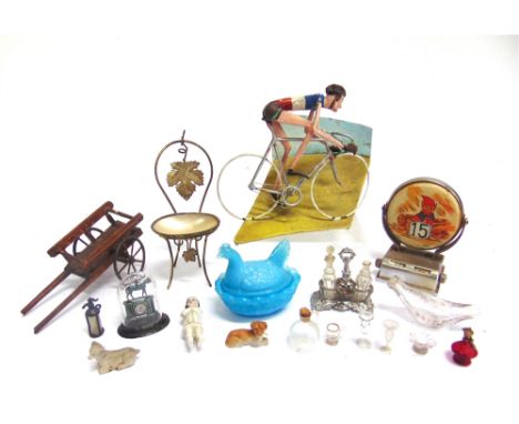 ASSORTED COLLECTABLES  comprising a metal and composition model of a racing cyclist, 13.5cm long; a perpetual desk calendar, 