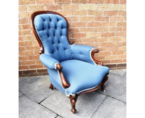A VICTORIAN BUTTON BACK CHAIR  with a serpentine front, upholstered in a blue fabric Condition Report : In good condition Con