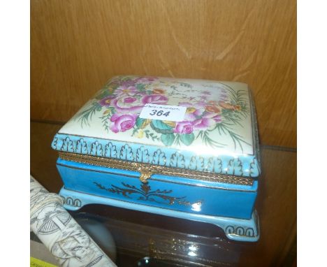 A Sevres style trinket box with floral decoration 9 x 18 x 15 