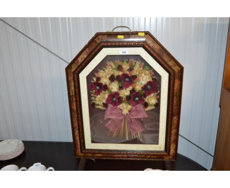 A fire screen with dried flower decoration