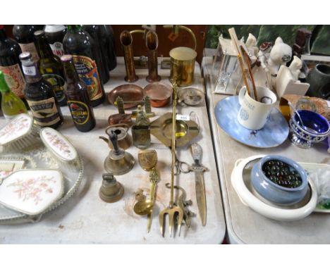 A collection of metalware to include a pair of brass candle sticks; toasting fork; hand bell etc