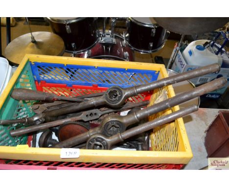 A box containing various tools to include wrench