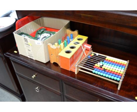 A collection of children's toys to include abacus and children's teaware
