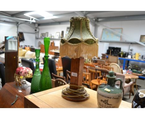 An oak standard lamp and shade