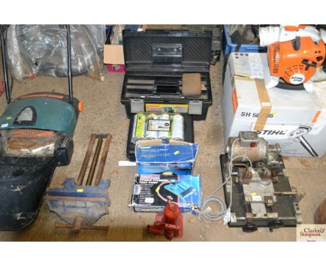 A double cylinder foot pump, a Halfords automatic inflator, a bottle jack, a camping gas stove, four cans of butane and a pla