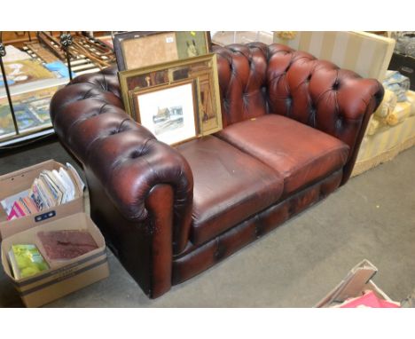 A Chesterfield style button down upholstered two seater settee