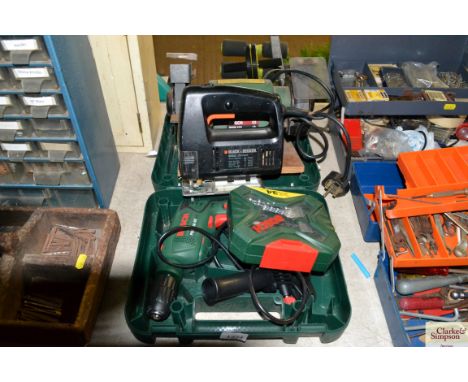 A Black &amp; Decker jig saw, a Bosch electric drill, and a Bosch sander etc.