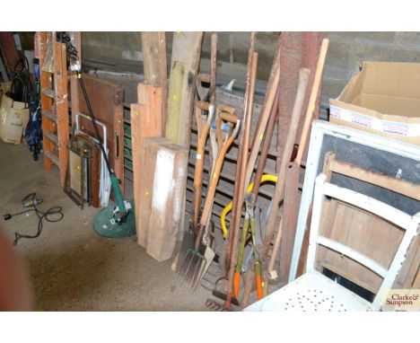 A collection of long handled garden tools to include shovel, spade, forks, rake etc. 