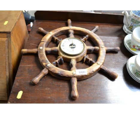 A barometer in the form of a ships wheel
