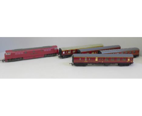 An OO gauge Lima diesel Western Gladiator and four LMS maroon coaches 