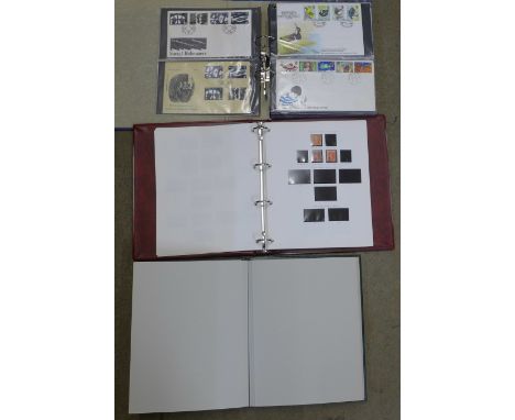 A collection of first day covers in album, an empty stamp album and an album containing British and foreign stamps 