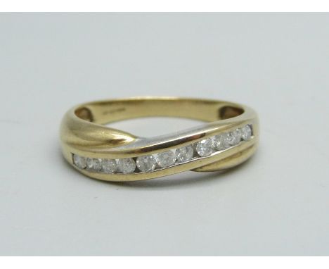 A 9ct gold ring set with diamonds, 2.1g, M 