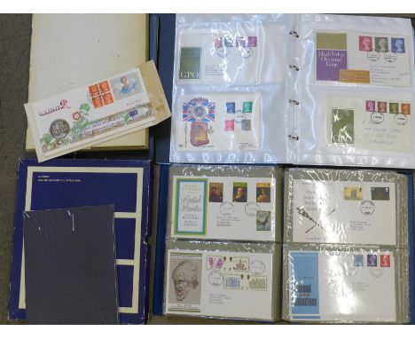 An album of first day covers and some presentation packs, a £5 coin cover, an album of mixed stamps, postal history, PHQ card