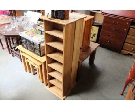 A pair of light oak open fronted CD storage units