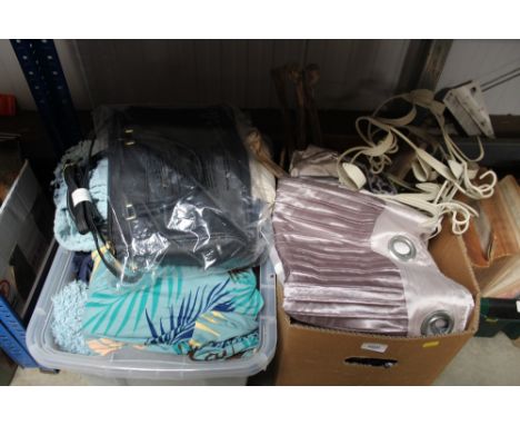 Two boxes of throws and curtains etc.