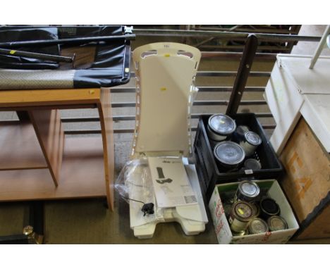 A Bellavita bath lift with instruction manual and power cable