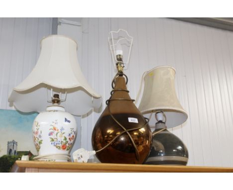 A pottery table lamp and shade; an Aynsley table lamp and shade and one other