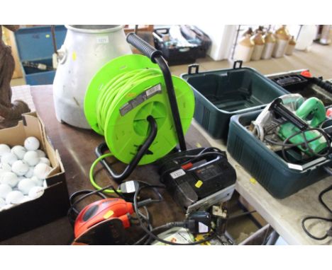A Black &amp; Decker mouse sander with sanding pads, a Black &amp; Decker Jigsaw and Status 50 meter 4 socket extension reel