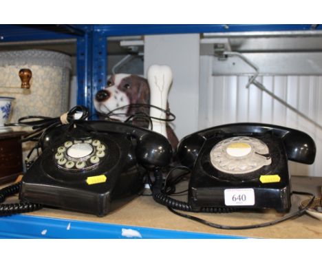 A rotary dial telephone; one other rotary dial style telephone and a novelty phone in the form of a dog and bone