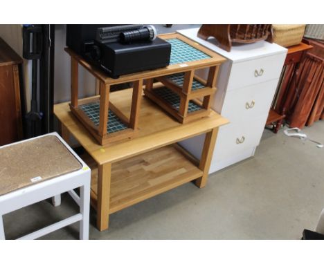 An oak and tiled stand together with a light oak coffee table